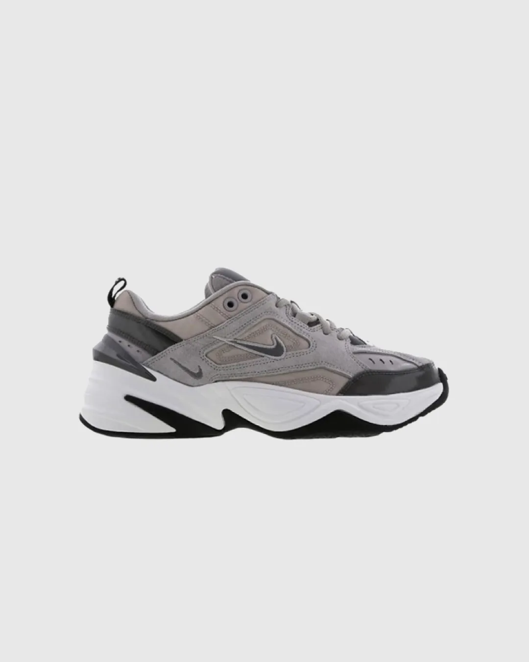 running in a bus station area shoes Nike M2K Tekno Atmosphere Grey Sneakers